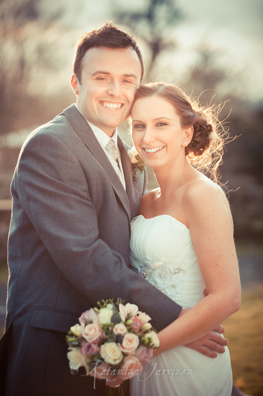 backlit portrait of bride and groom
